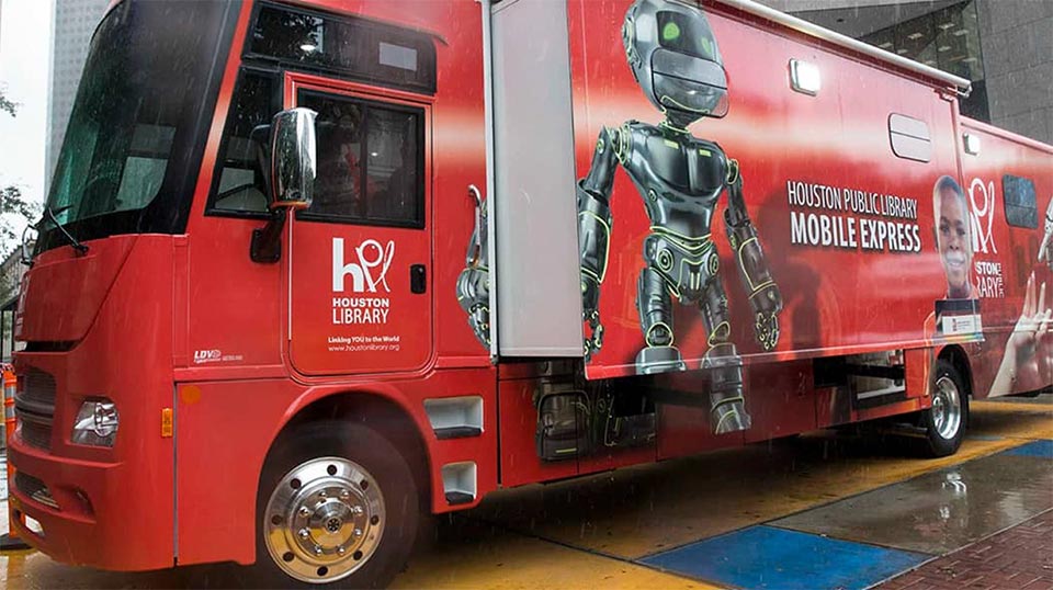The side of the Houston Public Library Mobile Express: a red bookmobile.