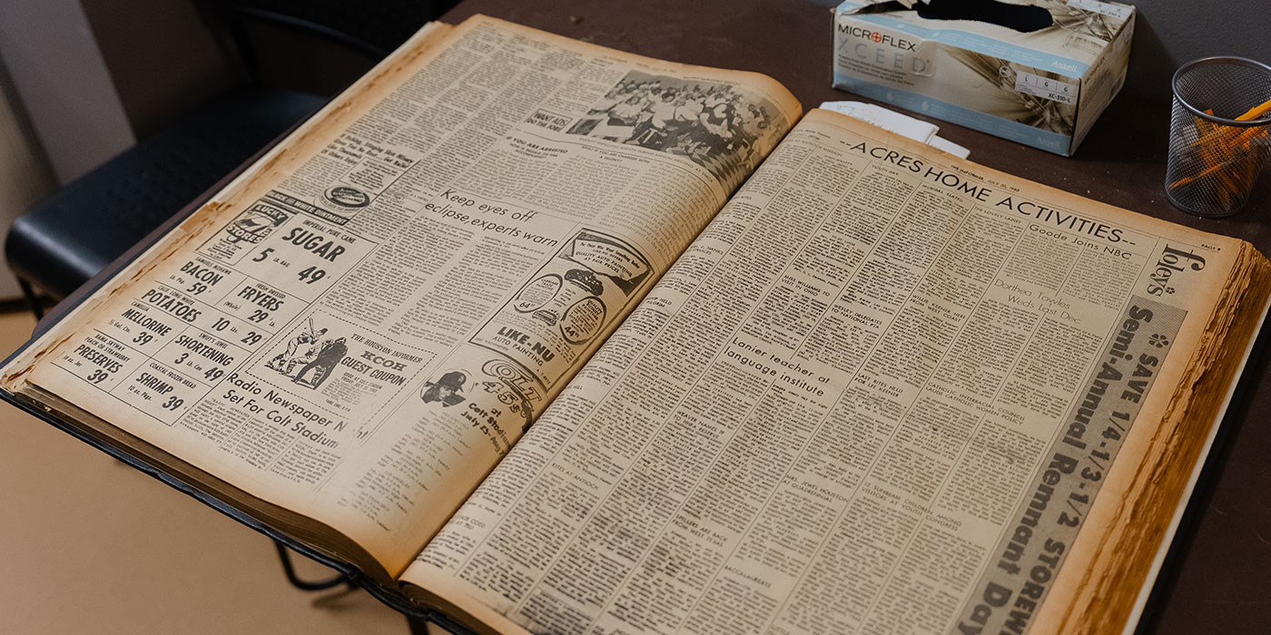 Large format open archival book.